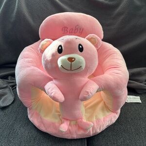 Pink plush baby girl seat